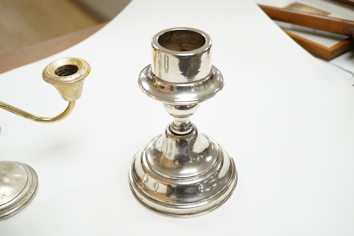 A pair of continental 800 standard white metal candlesticks, 15.5cm, 11.5oz, together with a Frank M. Whiting & Company sterling two branch, three light dwarf candelabrum, 15cm, weighted.